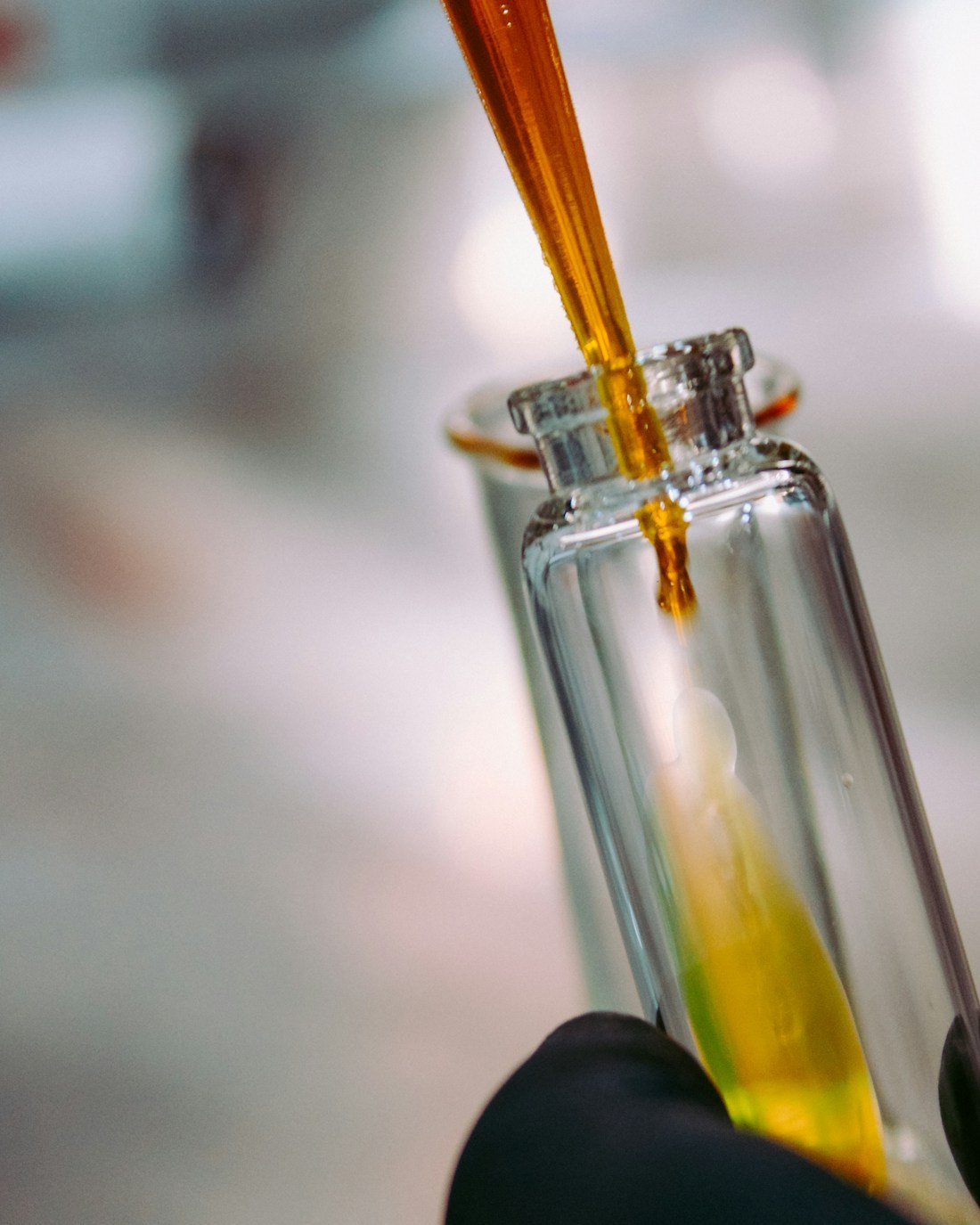Fragrance oil being carefully blended for a Pristine Aromas perfume